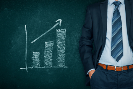 Businessman with hands in passive gesture and increasing graph.の写真素材
