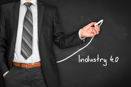 Industry 4.0 heading - title page or background template for business presentation about Industry 4.0. Businessman (manager, teacher, mentor, visionary) and growing graph.の写真素材
