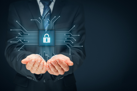 Information technology devices security concept. Businessman offer IT security service - button with padlock icon in simplified design of chip connected with abstract devices represented by points.の写真素材