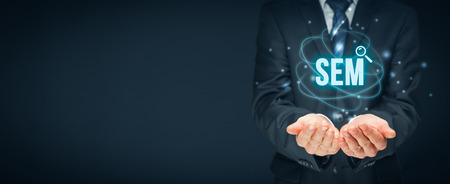 Search engine marketing - SEM concept. Businessman or programmer is focused to improve SEM and web traffic.の写真素材