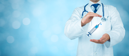 Immunization coverage concept. Practitioner doctor with protective gesture and icon of the hypodermic needle.の写真素材