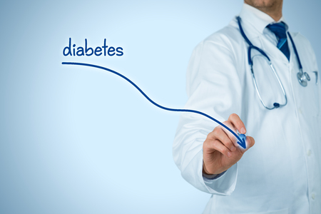 Reduction of the incidence of diabetes and diabetes prevention concept. Doctor (medical practitioner) draw descending graph of the incidence of diabetes.の写真素材