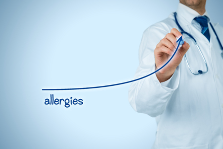 Allergies increasing concept. Doctor (medical practitioner) draw growing graph of increasing number of allergies.の写真素材