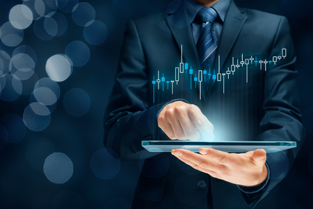Investor and trader concept - investor with tablet and tradeview graph.の写真素材