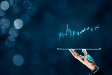 Investor and trader concept - investor with tablet and tradeview graph.の写真素材