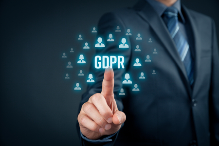 GDPR (general data protection regulation) concept. Businessman or IT technologist click on text GDPR and icons of people to implement GDPR.の写真素材