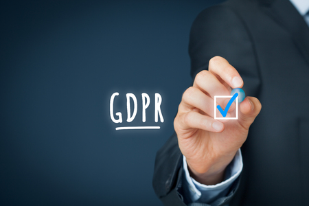 We are done, GDPR is implemented. Businessman or IT technologist is ready to GDPR. He ticks a finished job in checklist around GDPR including implementation.の写真素材