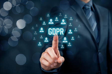 GDPR (general data protection regulation) concept. Businessman or IT technologist click on text GDPR and icons of people to implement GDPR.の写真素材