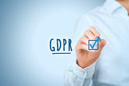 We are done, GDPR is implemented. Businessman or IT technologist is ready to GDPR. He ticks a finished job in checklist around GDPR including implementation.の写真素材