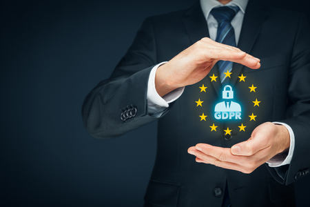 GDPR (general data protection regulation) concept. Businessman or IT technologist with text GDPR, person with lock instead of head and EU stars.の写真素材