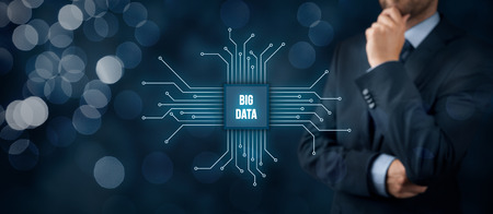 Big data analysis concept. Businessman or IT specialist with abstract symbol of a chip with text big data.の写真素材