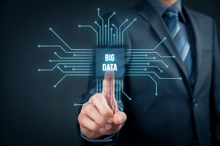 Big data analysis concept. Businessman or IT specialist with abstract symbol of a chip with text big data.の写真素材