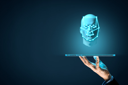 Digital tablet face detection and identification (ID) concept. Facial recognition protection and security.の写真素材