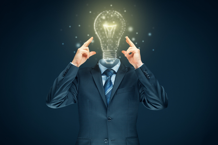Improve your creativity, idea and intelligence concepts. Businessman and graphics light bulb - symbols of idea, creative thinking, innovations and intelligence.の写真素材