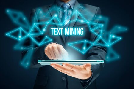 Text mining - process of deriving high-quality information from text. Text analysis concept with digital tablet.の写真素材