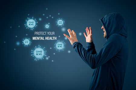 Protect your mental health in covid-19 crisis times (during lockdown and quarantine) concept. Don't read an excessive number of news about coronavirus. Man with defensive gesture.の写真素材
