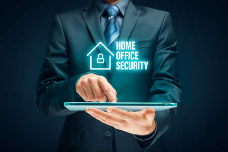 Cybersecurity concept with home office in covid-19 epidemic times. Danger of unsecured computers used in home offices.の写真素材