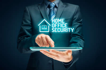 Cybersecurity concept with home office in covid-19 epidemic times. Danger of unsecured computers used in home offices.の写真素材