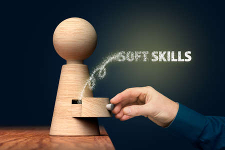 Discover your soft skills concept. Coach (manager, mentor) open drawer from wooden figurine, there is hidden skills going out.の写真素材