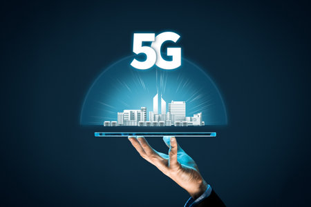 5G internet connection digital tablet concept. Person hold digital tablet with 5G broadband cellular network around city.の写真素材