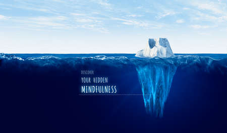 Discover your hidden mindfulness concept with iceberg. Motivational concept for personal growth with iceberg â bigger part representing undiscovered mindfulness is hidden under water.の写真素材