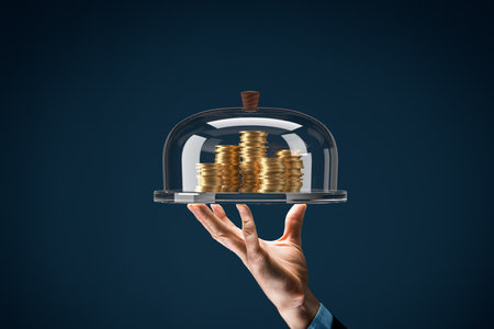 Financial services concept. Financial advisor or employee of the bank providing a loan represented by coins of money.の写真素材