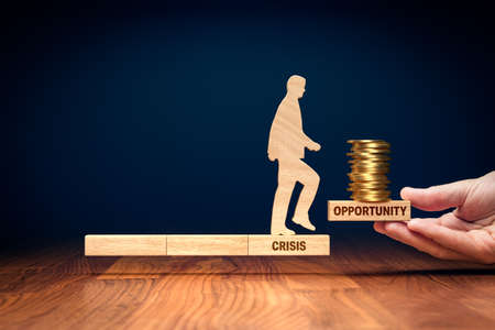 Crisis is opportunity to growth and monetize success - concept with wooden block and coins.の写真素材