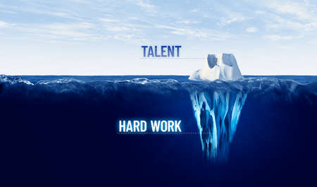Hard work is hidden behind every tapped talent. Motivational concept with iceberg to work hard to tap visible talent.の写真素材