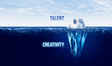 Discover your hidden creativity. Motivational concept with iceberg - bigger part representing undiscovered creativity is hidden under water.の写真素材