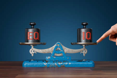 Intelligence and emotions (IQ and EQ) in balance concept. Personal coach helps to achieve balance.の写真素材