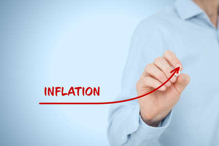 Growing inflation concept with businessman drawing growing simple graph.の写真素材