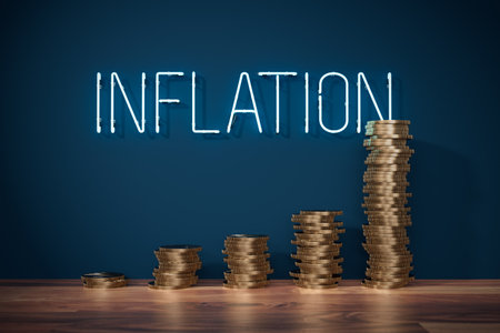 Growing inflation concept with coins and neon text inflation in background. Fast increase of inflation visual metaphor.の写真素材