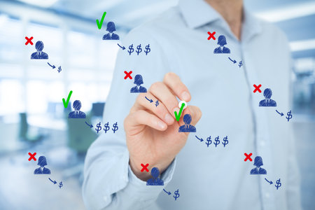 Businessman identifies the most profitable customers or clients and pays special attention to them. Business efficiency concept. The right selection of human resources brings higher profit to the company.の写真素材
