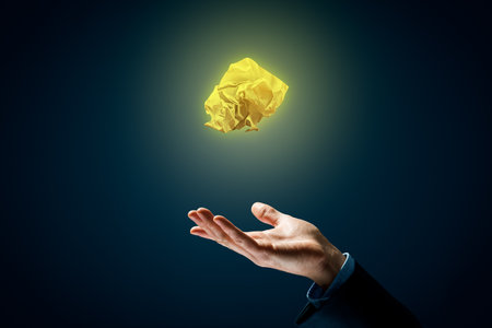 No idea, creativity improvement concept. Crumpled paper above hand. Creative company has solution - advertisement concept.の写真素材
