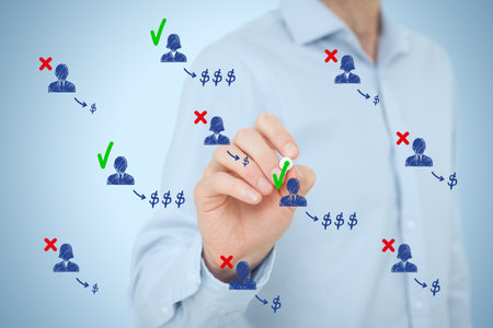 Businessman identifies the most profitable customers or clients and pays special attention to them. Business efficiency concept. The right selection of human resources brings higher profit to the company.の写真素材