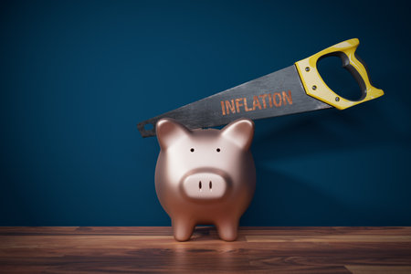 Inflation destroys savings concept. Piggy bank with savings inside and saw (with text inflation) destroys piggy bank.の写真素材