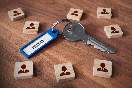 A well-functioning team and human resources is the key to the company's profit. Human resources concept with key, key tag and wooden cubes with people symbol.の写真素材