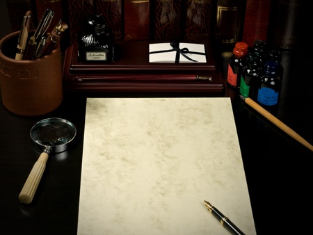 Vintage desk with blank paperの写真素材