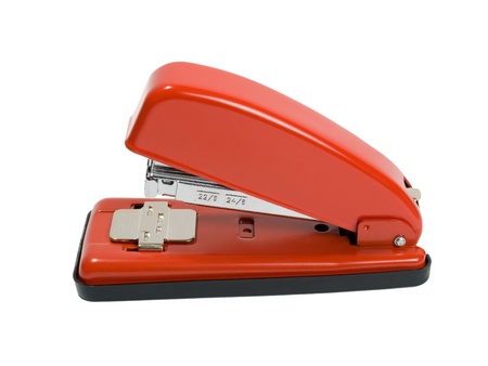 Red stapler on white backgroundの写真素材