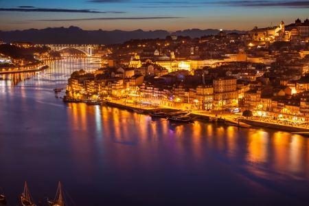 Panoramic of old Porto and Douro river at night, Portugalの写真素材
