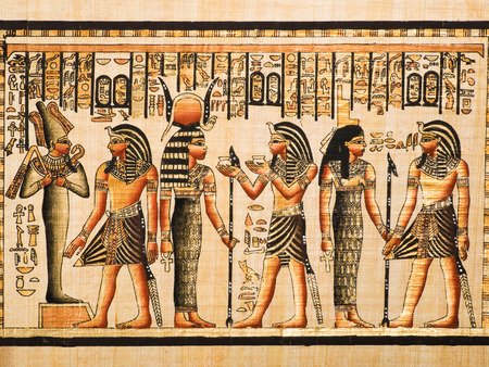 Egyptian papyrus showing the Pharaoh Tutankhamen and gods Osiris, Hathor and Isisのeditorial素材