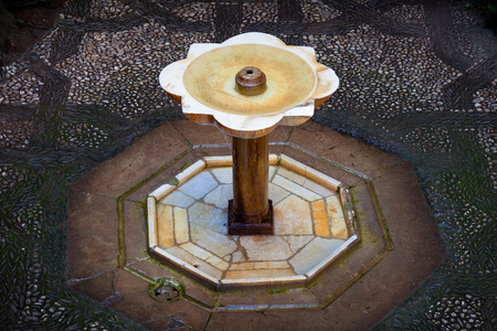 Granada, Spain - October 03, 2013: Muslim fountain in a court of the Nasrid Palaces. Alhambra de Granada, Spainのeditorial素材