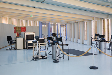 Security checkpoint in an entrance hall with some x-ray metal detectors