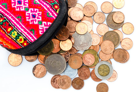 Thai coin dimes, dollar Hong Kong coin and Japanese Yen coin. Wallet and coin on white background.の写真素材