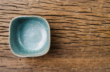 Empty bowl on rustic wood, Japanese handmade ceramic bowl, ceramic textureの写真素材