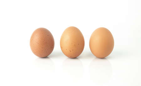 Fresh eggs are isolated on white background. Chicken eggs are rich in protein, vitamins, and essential minerals that are beneficial to the body.の写真素材