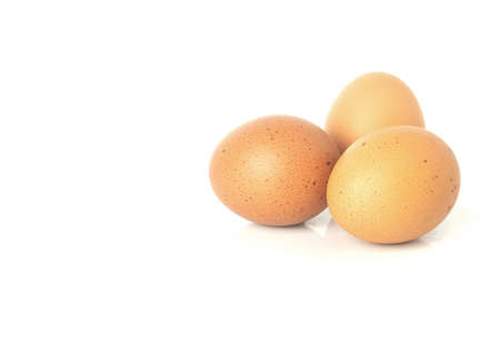 Fresh eggs are isolated on white background. Chicken eggs are rich in protein, vitamins, and essential minerals that are beneficial to the body.の写真素材