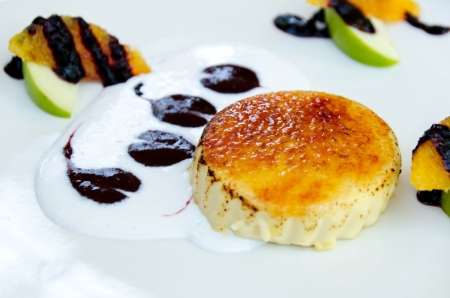 Panna cotta dessert with  blueberries sauce  geen apple orange and cream