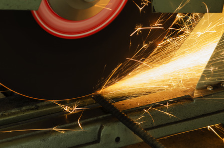 Cut metal with grinder machine, Sparks while grinding iron.