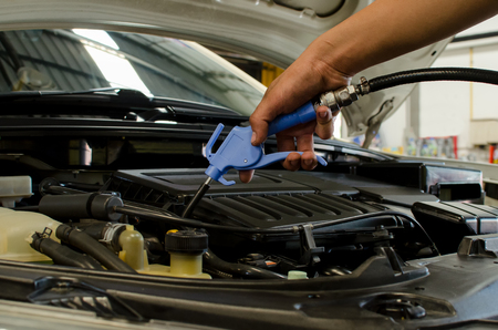 Cleaning Car Engine By Air Gun Pressure.の写真素材